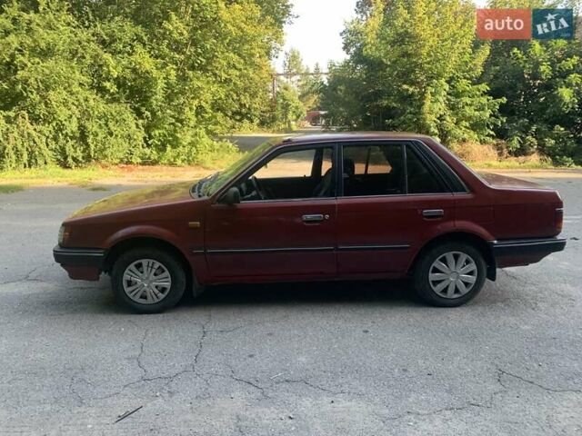 Червоний Мазда 323, об'ємом двигуна 1.3 л та пробігом 450 тис. км за 950 $, фото 1 на Automoto.ua