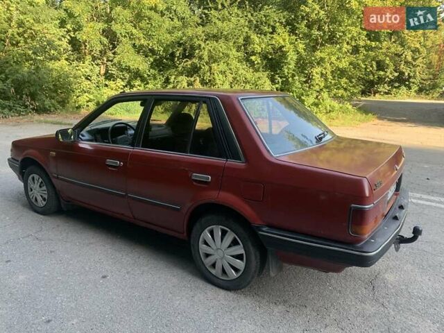 Червоний Мазда 323, об'ємом двигуна 1.3 л та пробігом 450 тис. км за 950 $, фото 2 на Automoto.ua