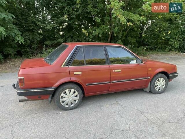 Червоний Мазда 323, об'ємом двигуна 1.3 л та пробігом 450 тис. км за 950 $, фото 5 на Automoto.ua