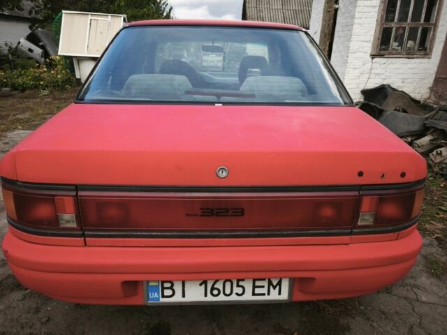 Красный Мазда 323, объемом двигателя 1.6 л и пробегом 500 тыс. км за 400 $, фото 4 на Automoto.ua