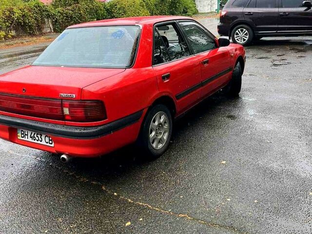 Красный Мазда 323, объемом двигателя 1.6 л и пробегом 240 тыс. км за 1200 $, фото 1 на Automoto.ua