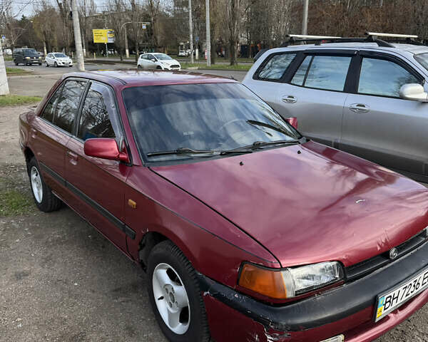 Красный Мазда 323, объемом двигателя 1.6 л и пробегом 350 тыс. км за 1200 $, фото 1 на Automoto.ua