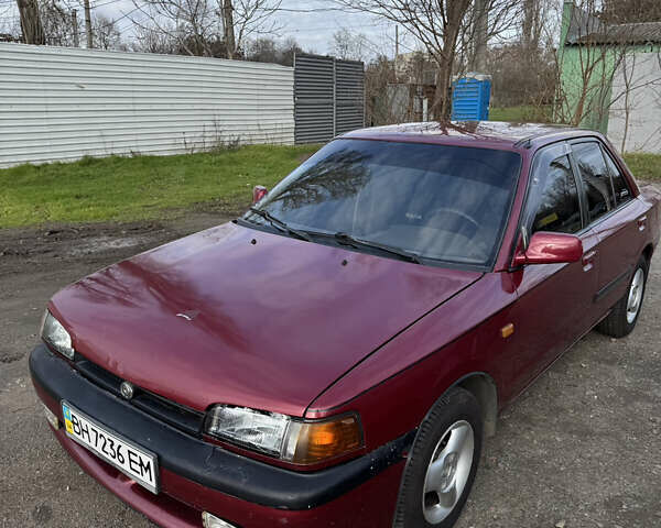 Красный Мазда 323, объемом двигателя 1.6 л и пробегом 350 тыс. км за 1200 $, фото 2 на Automoto.ua