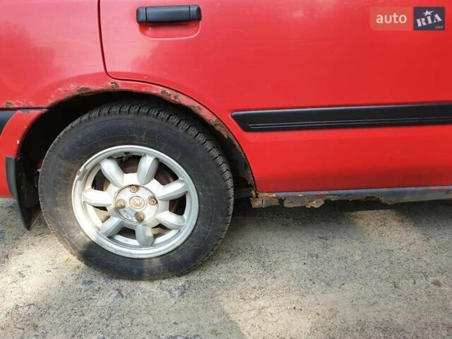 Червоний Мазда 323, об'ємом двигуна 1.5 л та пробігом 339 тис. км за 1900 $, фото 1 на Automoto.ua