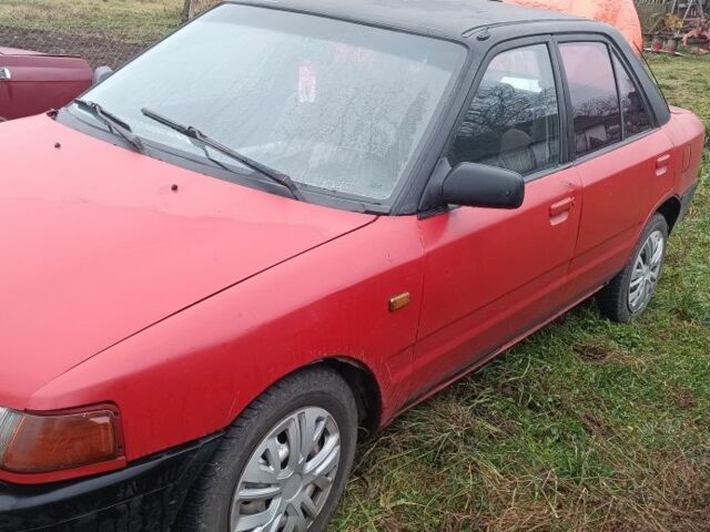 Красный Мазда 323, объемом двигателя 1.3 л и пробегом 300 тыс. км за 475 $, фото 1 на Automoto.ua