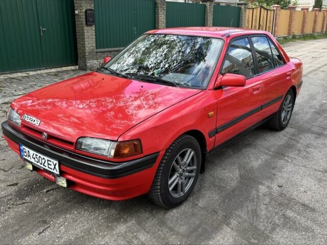 Красный Мазда 323, объемом двигателя 1.6 л и пробегом 313 тыс. км за 2000 $, фото 2 на Automoto.ua