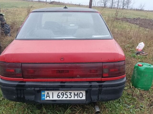 Красный Мазда 323, объемом двигателя 1.3 л и пробегом 300 тыс. км за 475 $, фото 2 на Automoto.ua
