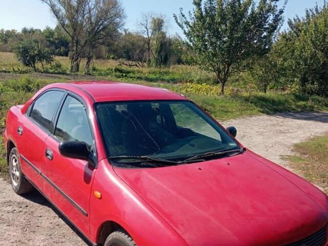 Червоний Мазда 323, об'ємом двигуна 0 л та пробігом 350 тис. км за 1800 $, фото 16 на Automoto.ua