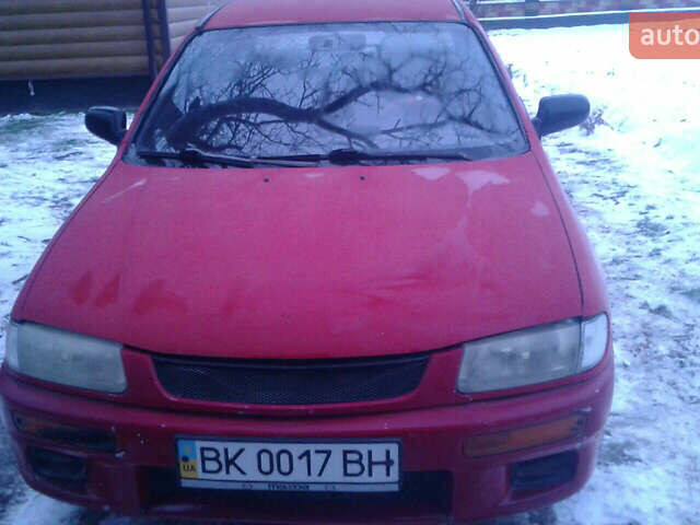 Червоний Мазда 323, об'ємом двигуна 1.5 л та пробігом 255 тис. км за 2500 $, фото 1 на Automoto.ua