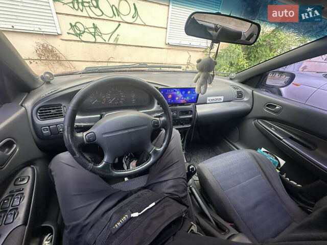 Красный Мазда 323, объемом двигателя 1.5 л и пробегом 295 тыс. км за 2500 $, фото 6 на Automoto.ua
