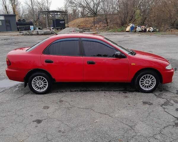 Червоний Мазда 323, об'ємом двигуна 1.49 л та пробігом 290 тис. км за 2800 $, фото 1 на Automoto.ua