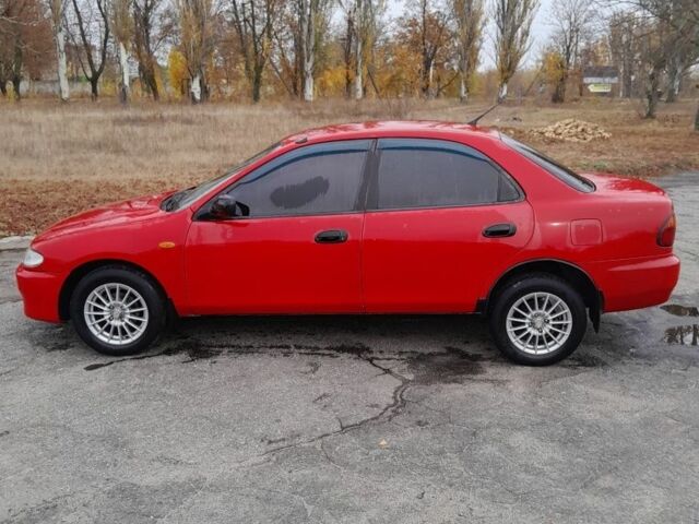 Червоний Мазда 323, об'ємом двигуна 1.5 л та пробігом 290 тис. км за 2800 $, фото 2 на Automoto.ua