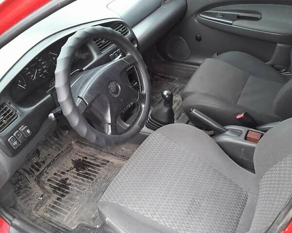 Червоний Мазда 323, об'ємом двигуна 1.49 л та пробігом 290 тис. км за 2800 $, фото 5 на Automoto.ua