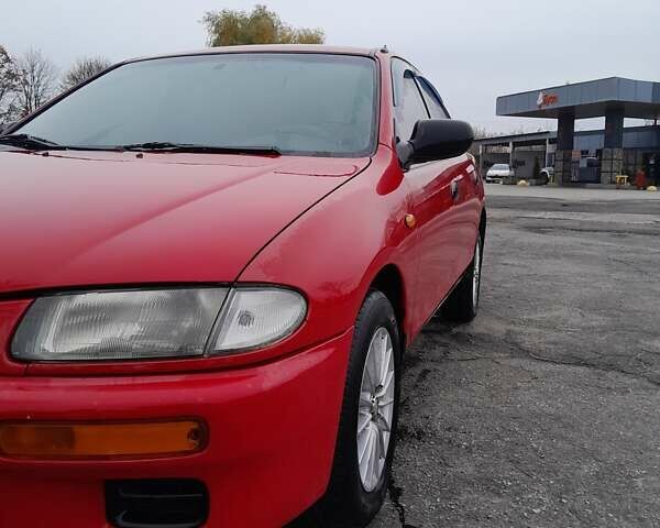 Червоний Мазда 323, об'ємом двигуна 1.49 л та пробігом 290 тис. км за 2800 $, фото 4 на Automoto.ua