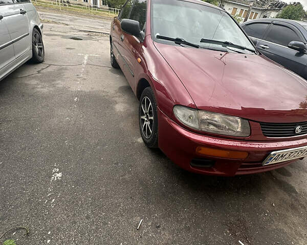 Красный Мазда 323, объемом двигателя 1.5 л и пробегом 295 тыс. км за 2500 $, фото 1 на Automoto.ua