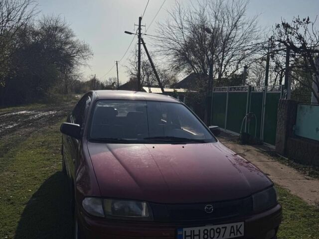 Червоний Мазда 323, об'ємом двигуна 1.8 л та пробігом 1 тис. км за 2450 $, фото 3 на Automoto.ua