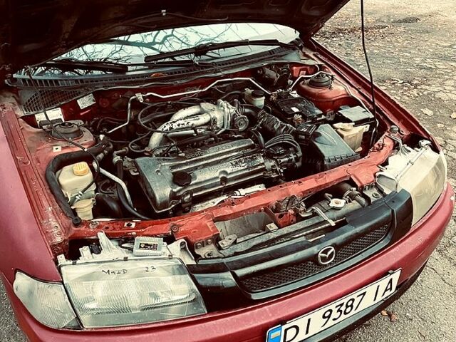 Красный Мазда 323, объемом двигателя 1.5 л и пробегом 0 тыс. км за 1600 $, фото 2 на Automoto.ua
