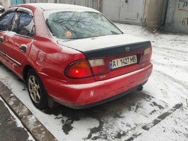 Красный Мазда 323, объемом двигателя 1.5 л и пробегом 381 тыс. км за 1450 $, фото 2 на Automoto.ua