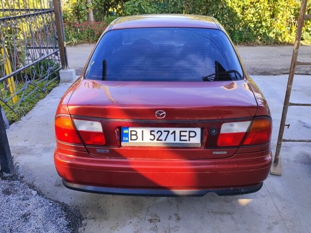 Красный Мазда 323, объемом двигателя 1 л и пробегом 315 тыс. км за 1800 $, фото 3 на Automoto.ua