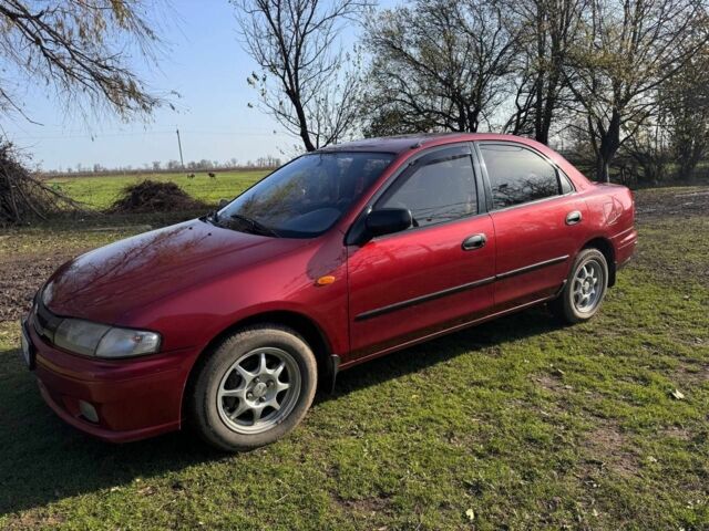 Червоний Мазда 323, об'ємом двигуна 1.8 л та пробігом 1 тис. км за 2450 $, фото 1 на Automoto.ua