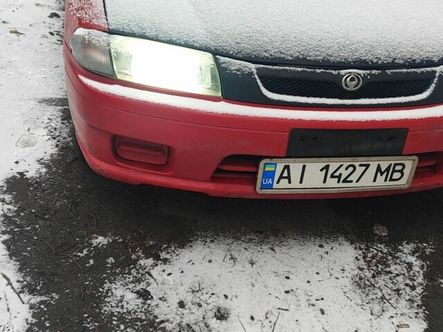 Красный Мазда 323, объемом двигателя 1.5 л и пробегом 381 тыс. км за 1450 $, фото 1 на Automoto.ua