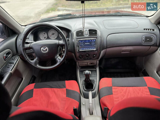 Красный Мазда 323, объемом двигателя 1.6 л и пробегом 333 тыс. км за 1500 $, фото 6 на Automoto.ua