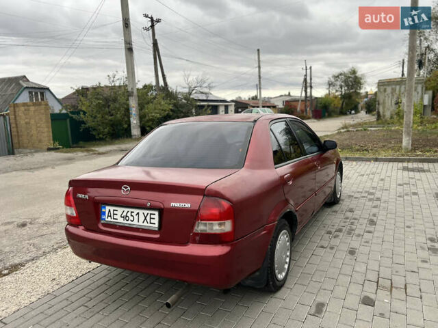 Красный Мазда 323, объемом двигателя 1.6 л и пробегом 333 тыс. км за 1500 $, фото 3 на Automoto.ua