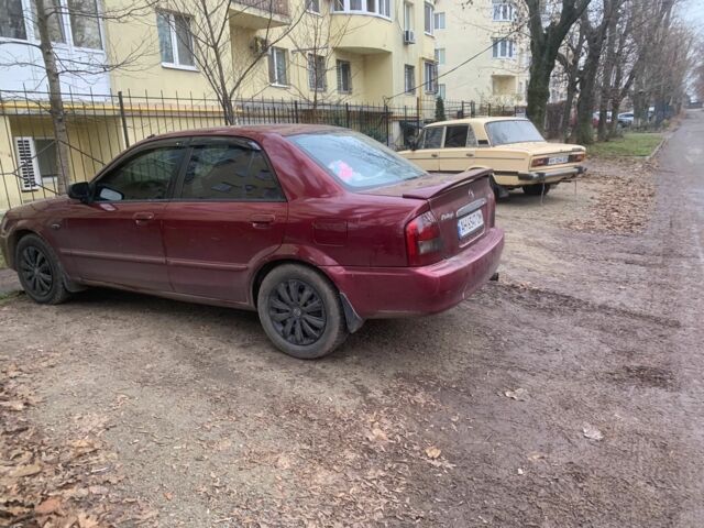 Червоний Мазда 323, об'ємом двигуна 2 л та пробігом 167 тис. км за 2400 $, фото 4 на Automoto.ua