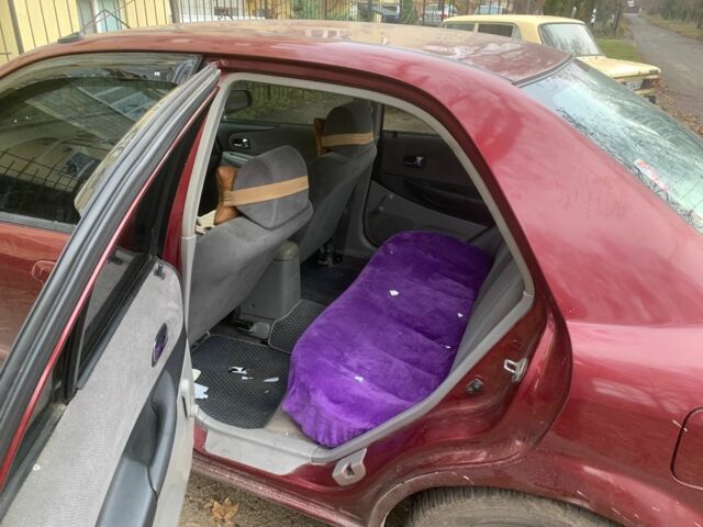 Червоний Мазда 323, об'ємом двигуна 2 л та пробігом 167 тис. км за 2400 $, фото 5 на Automoto.ua