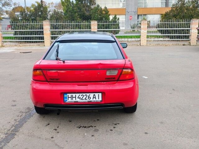 Красный Мазда 323, объемом двигателя 1.5 л и пробегом 270 тыс. км за 1500 $, фото 2 на Automoto.ua