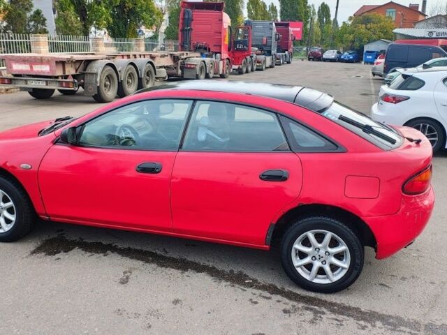 Красный Мазда 323, объемом двигателя 1.5 л и пробегом 270 тыс. км за 1500 $, фото 1 на Automoto.ua