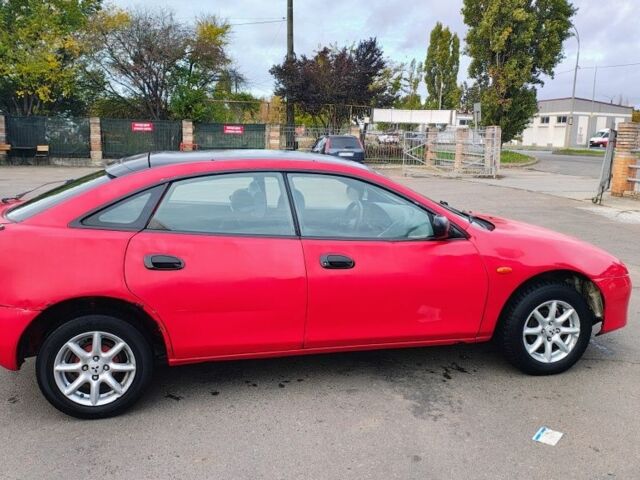 Красный Мазда 323, объемом двигателя 1.5 л и пробегом 270 тыс. км за 1500 $, фото 3 на Automoto.ua