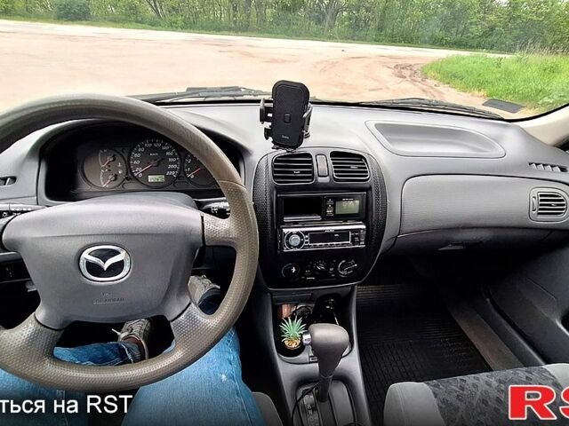 Мазда 323, об'ємом двигуна 1.5 л та пробігом 178 тис. км за 2400 $, фото 4 на Automoto.ua