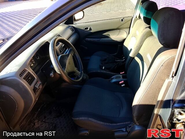 Мазда 323, объемом двигателя 1.6 л и пробегом 80 тыс. км за 1800 $, фото 4 на Automoto.ua