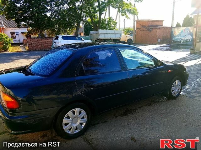 Мазда 323, объемом двигателя 1.6 л и пробегом 80 тыс. км за 1800 $, фото 7 на Automoto.ua
