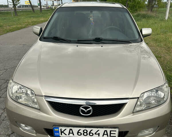 Желтый Мазда 323, объемом двигателя 1.6 л и пробегом 225 тыс. км за 2900 $, фото 1 на Automoto.ua