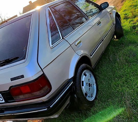 Серый Мазда 323, объемом двигателя 1.3 л и пробегом 454 тыс. км за 850 $, фото 2 на Automoto.ua