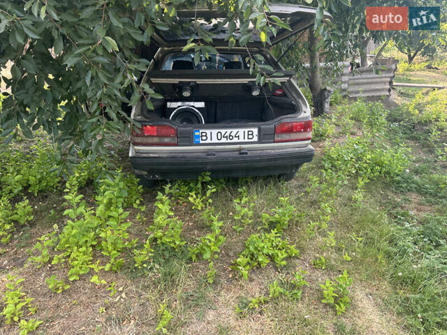 Серый Мазда 323, объемом двигателя 1.32 л и пробегом 153 тыс. км за 1075 $, фото 3 на Automoto.ua