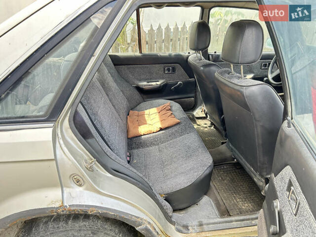 Серый Мазда 323, объемом двигателя 1.3 л и пробегом 200 тыс. км за 1001 $, фото 12 на Automoto.ua