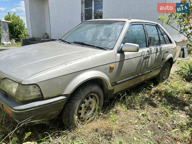 Серый Мазда 323, объемом двигателя 1.3 л и пробегом 200 тыс. км за 1001 $, фото 4 на Automoto.ua