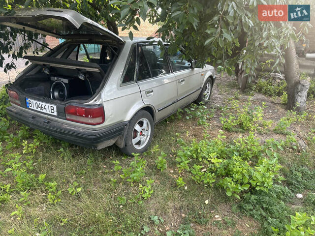 Серый Мазда 323, объемом двигателя 1.32 л и пробегом 153 тыс. км за 1075 $, фото 4 на Automoto.ua