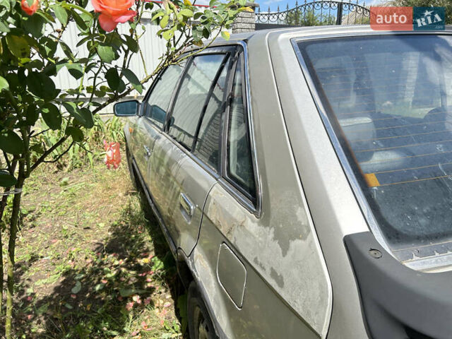 Серый Мазда 323, объемом двигателя 1.3 л и пробегом 200 тыс. км за 1001 $, фото 3 на Automoto.ua