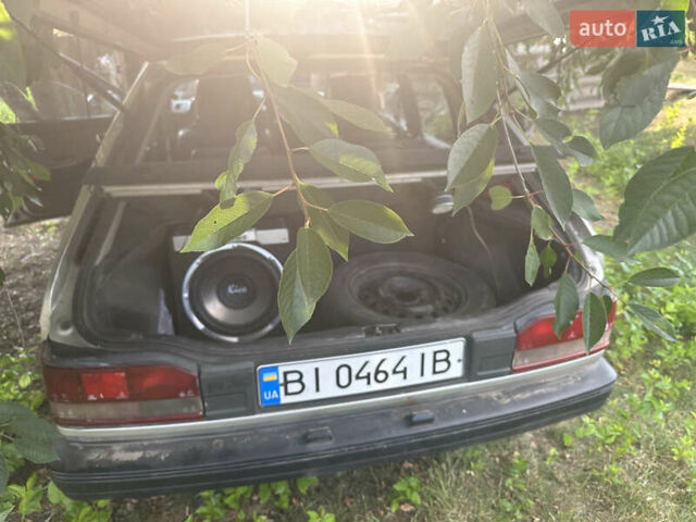 Серый Мазда 323, объемом двигателя 1.32 л и пробегом 153 тыс. км за 1075 $, фото 2 на Automoto.ua