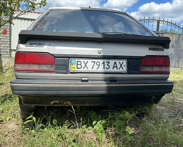 Серый Мазда 323, объемом двигателя 1.3 л и пробегом 200 тыс. км за 1001 $, фото 1 на Automoto.ua