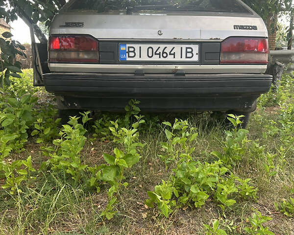 Серый Мазда 323, объемом двигателя 1.32 л и пробегом 153 тыс. км за 1075 $, фото 1 на Automoto.ua