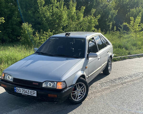 Серый Мазда 323, объемом двигателя 1.32 л и пробегом 460 тыс. км за 1500 $, фото 1 на Automoto.ua