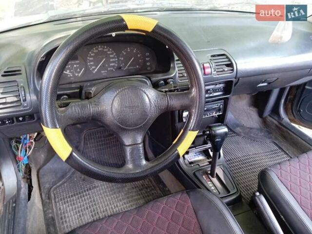 Серый Мазда 323, объемом двигателя 1.6 л и пробегом 300 тыс. км за 688 $, фото 4 на Automoto.ua