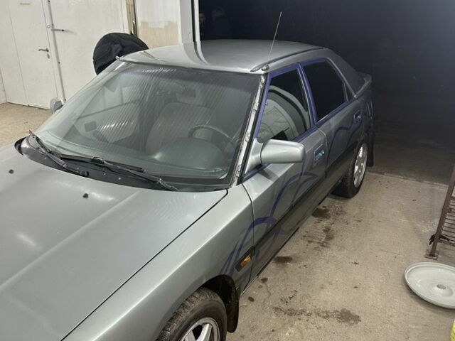 Сірий Мазда 323, об'ємом двигуна 1.8 л та пробігом 350 тис. км за 1400 $, фото 3 на Automoto.ua