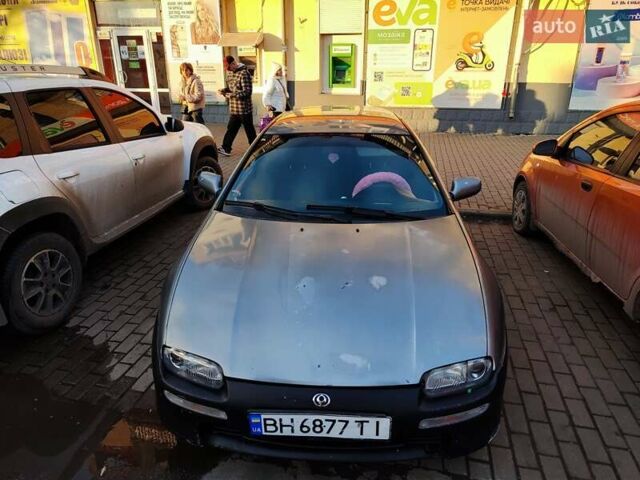 Сірий Мазда 323, об'ємом двигуна 1.6 л та пробігом 293 тис. км за 3000 $, фото 1 на Automoto.ua