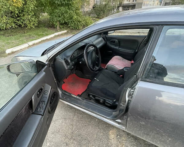 Серый Мазда 323, объемом двигателя 2 л и пробегом 280 тыс. км за 2500 $, фото 1 на Automoto.ua